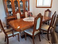 Full dining set view showing six chairs around table