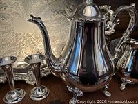 Tray, teapot-coffee pot, pair of bud vases-candlesticks visible