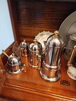 Coffee set pieces grouped on shelf
