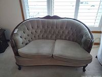 Front view of tufted loveseat