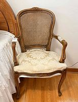 Front 3/4 view of complete chair beside bed