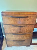 Front view showing four drawers, veneer finish, integrated pulls