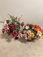 Both artificial flower arrangements side by side