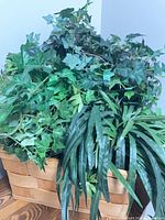 Basket holding mixed artificial plants