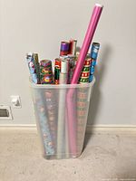 Bin with assorted wrapping paper rolls