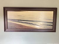 Full view of framed beach print on wall