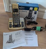 Handset on base, original box, adapter, cord, user guide visible