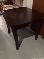 Overall view of dark brown wood end table
