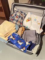 Tote filled with various fabric pieces showing different prints and colours