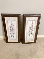 Both framed floral prints side by side