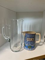 Both pitchers side by side showing size comparison and design details