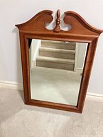 Front view of wooden framed mirror