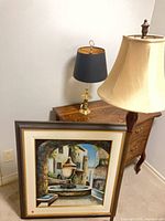 Group shot showing floor lamp, table lamp on stand, framed painting