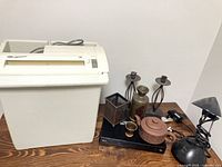 All items grouped: shredder, Blu-ray player, candlesticks, lamp, pencil holder, ceramics