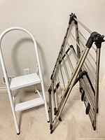 Two-step stool and folded drying rack side by side