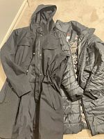 Both jackets laid flat showing overall design