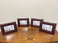 All four matching faux leather frames on table