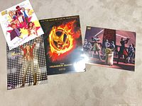 Group shot of all four posters laid on floor