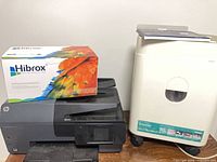HP OfficeJet printer with Hibrox toner box on top and Royal shredder beside