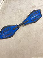 Full view of blue RipStik caster board on floor