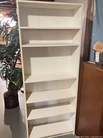 front view of white six-shelf bookcase