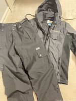 Overall view of jacket and snow pants