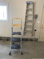 Both ladders standing in garage