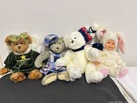 Group shot of four plush toys