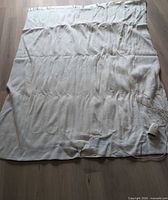 Blanket laid flat showing full size and overall condition