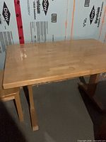 Rectangular pine kitchen table with small matching end table beside it