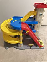 Overall view of Fisher-Price Big Action Parking Garage showing spiral ramp, straight ramp and elevator tower