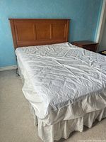 Full bed showing headboard, mattress and skirt