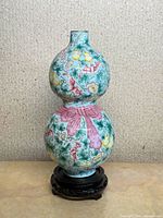 Full view of enameled double gourd vase on stand
