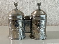 Front view showing both connected vessels and decorative motif