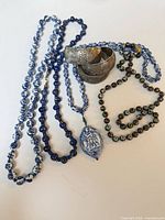 All three necklaces and three cuff bracelets laid out together