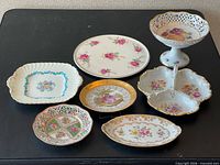 All seven porcelain pieces arranged on table