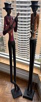 Both musician statues side by side