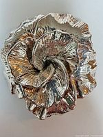 Front view showing sculptural flower design