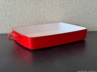 Full view of red and white enamel baking dish