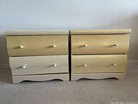 Front view of both nightstands showing drawer fronts and overall condition