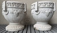 pair of cement planters front view showing Greek key and grape motif