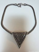 Full view of necklace showing pendant and chain