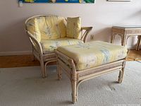 Rattan chair with matching ottoman, cushions in place