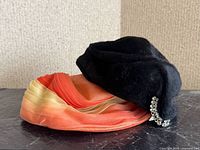 Both hats side by side highlighting colors and styles