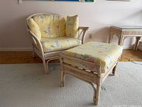 Rattan chair and ottoman set showing cushions and frame