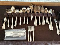 Overall view of Rogers Brothers Springtime flatware pieces in storage rack