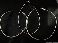 All three necklaces overview on black background