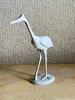 Front left view of porcelain bird figurine
