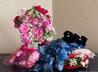 Group shot of all five vintage floral hats