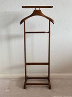 Full view of wooden valet stand